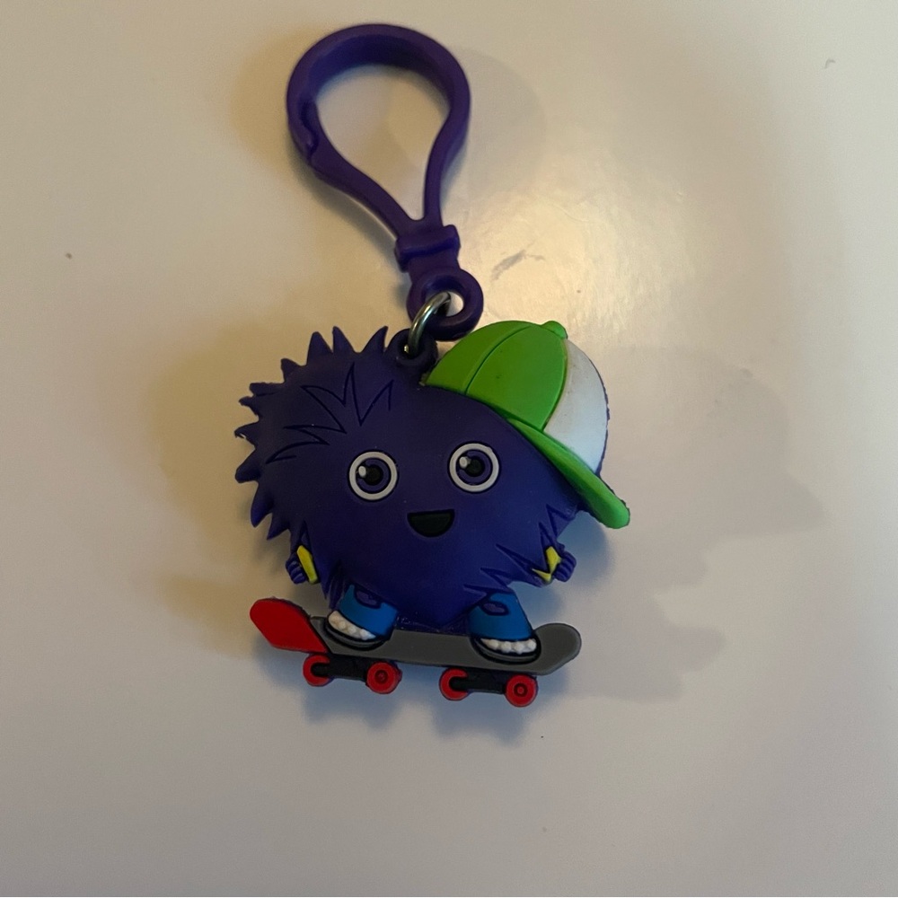 Purple Heart Skateboarder Keychain with Green Cap bag tag